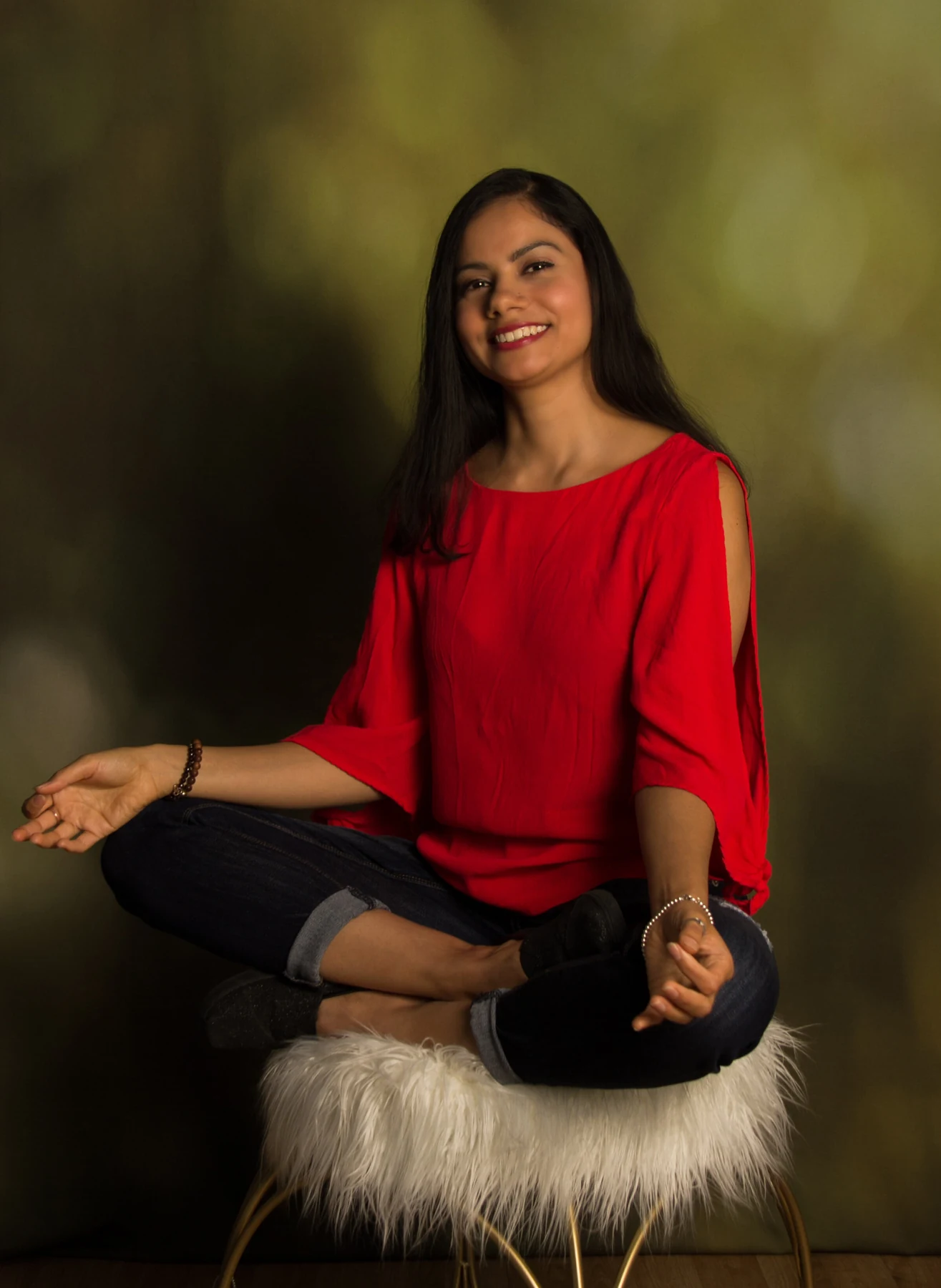 A smiling woman in a quiet, reflective portrait